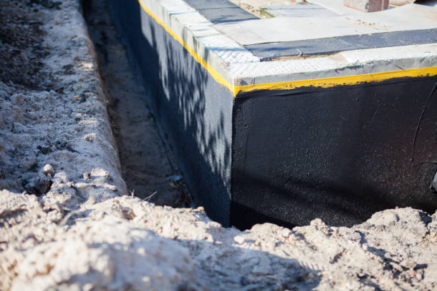 Professional Exterior Waterproofing technician working in Grand Ledge, MI